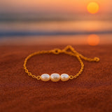 A bracelet with three pearls